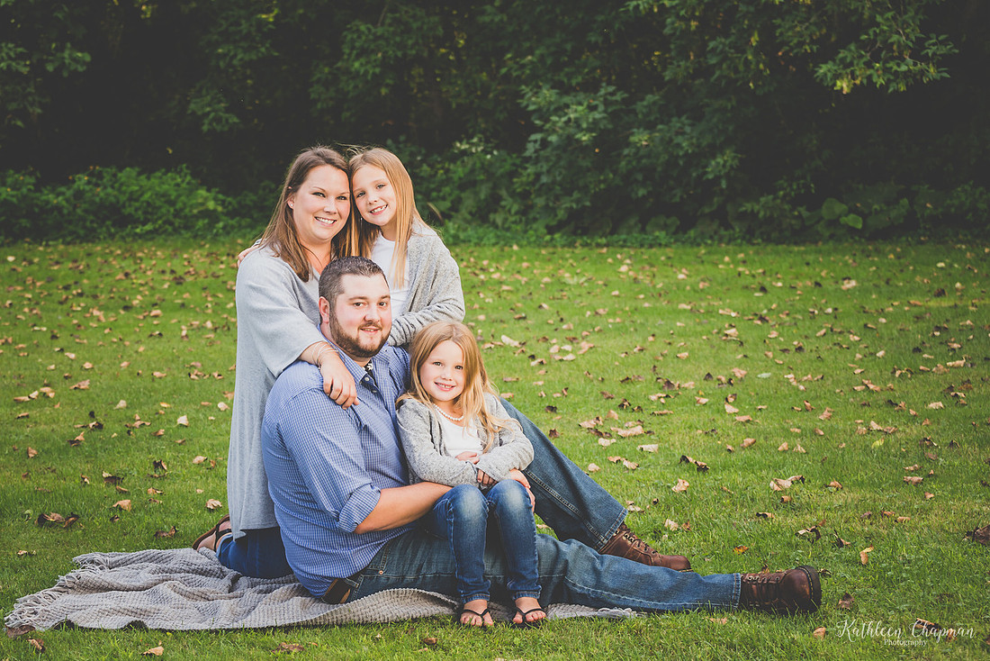 family of four in portrait in Madrid Park NY extended family session st. lawrence country family photographer