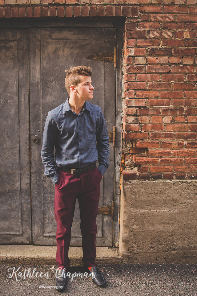 Profile of senior boy in brick alley in Massena NY Franklin County child photographer