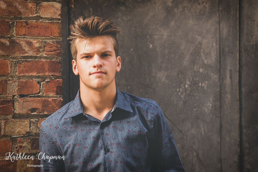 Senior guy in alley in Massena NY north country ny family photographer