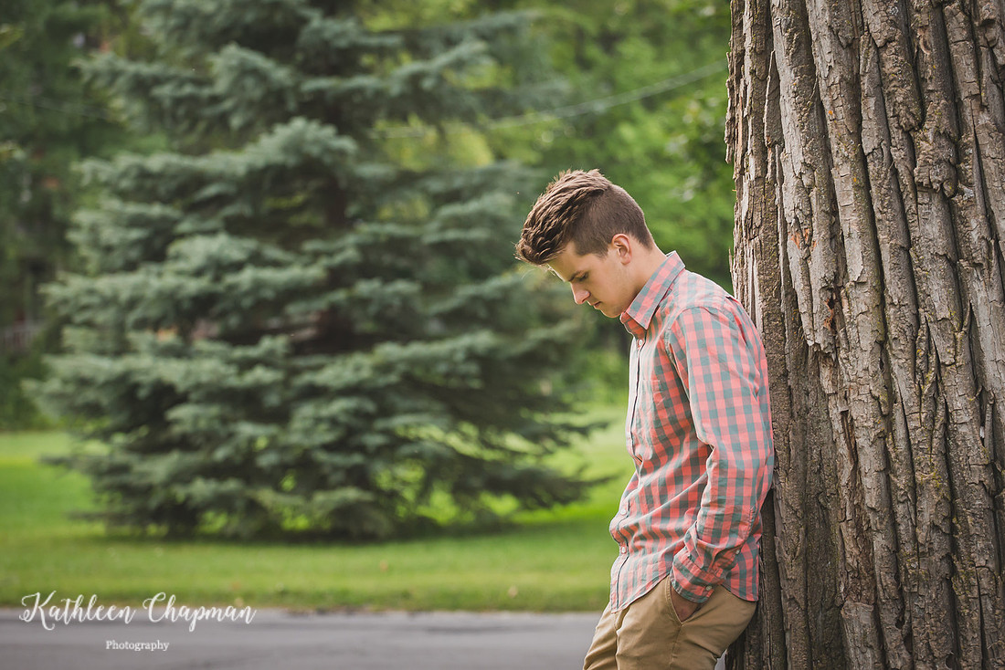 Senior boy by big tree in park in Massena NY Franklin county child photographer