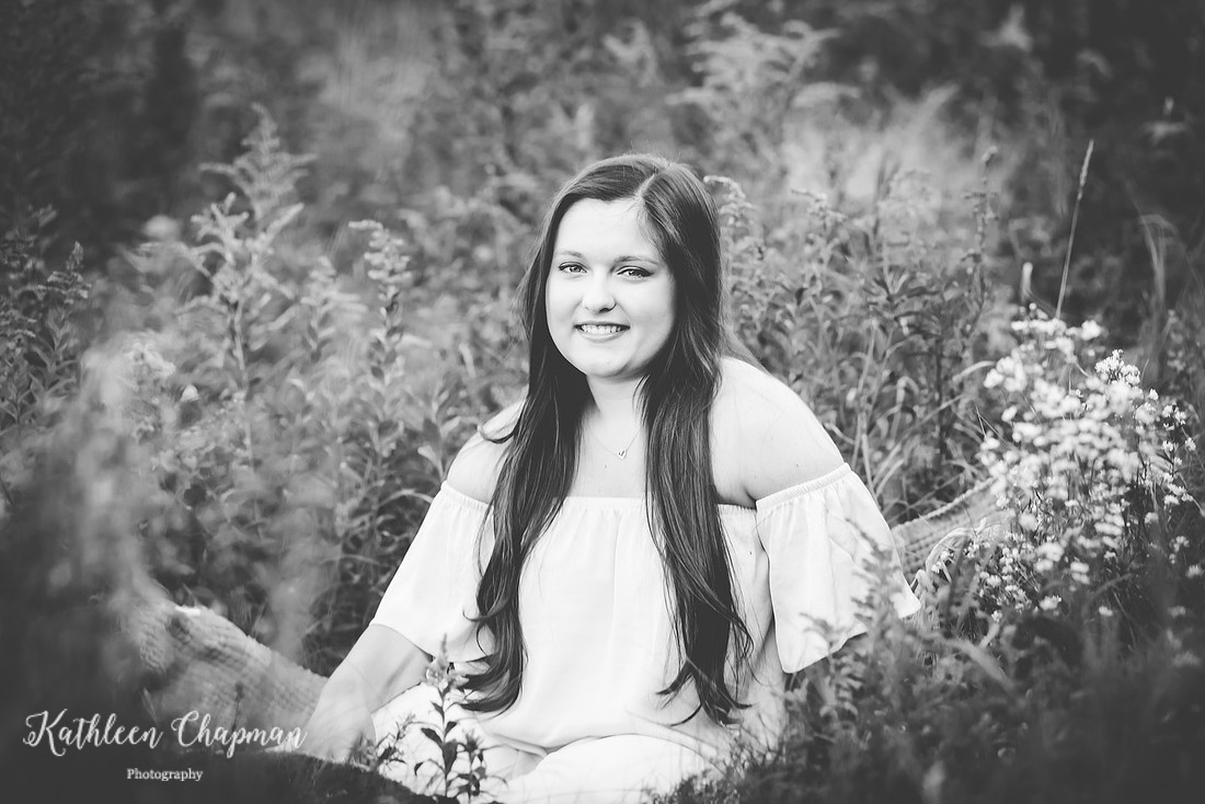 Senior girl smiling in wild flower field potsdam ny family photographer