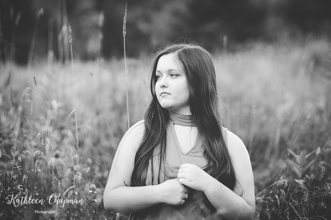 black and white portrait of senior girl in field st. lawrence county senior photographer