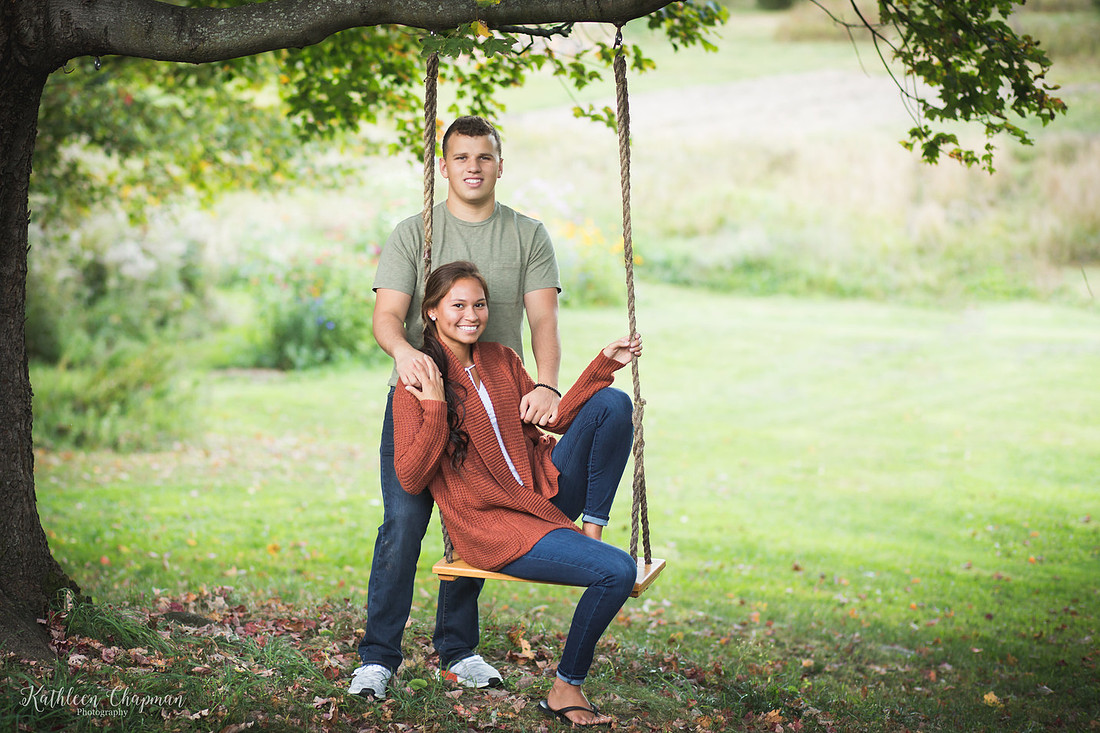 smiling couple on swing franklin country ny family photographer