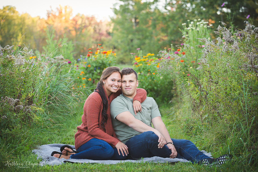 couple in wild flower garden dickinson center ny family photographer