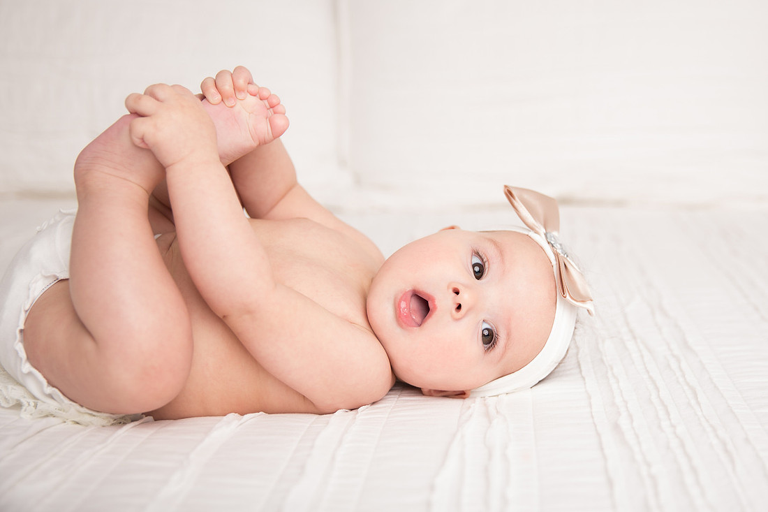 baby girl playing with toes potsdam ny child photographer