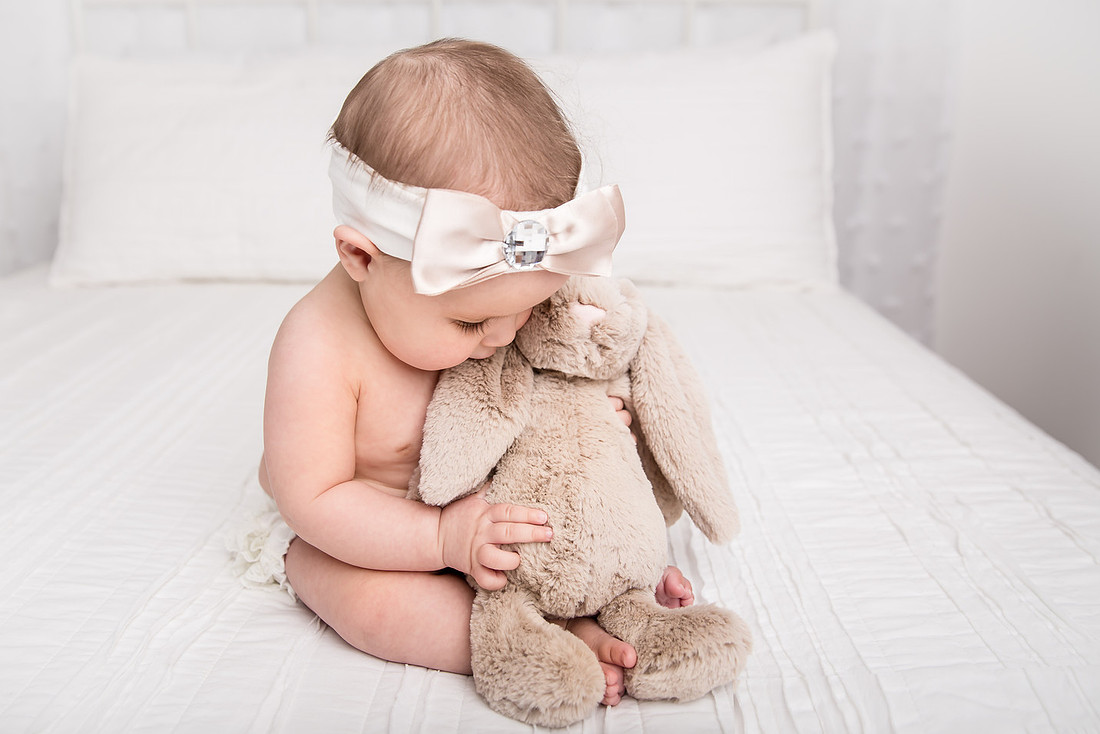 baby girl snuggling stuffed bunny potsdam ny child photographer