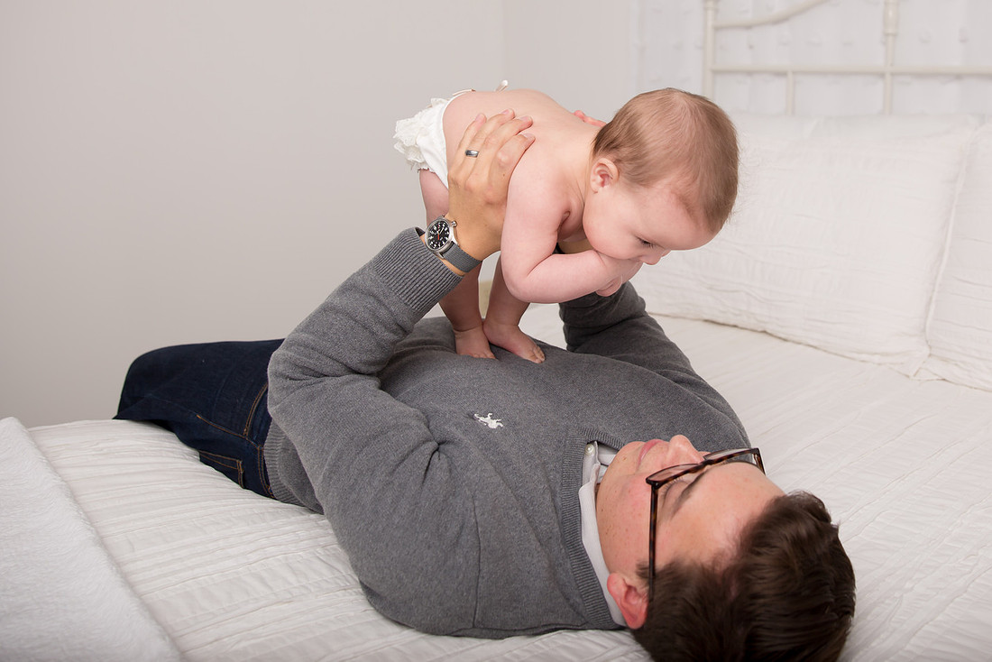 dad playing with baby girl st. lawrence county family photographer